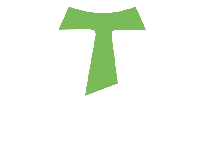 Franziskus-Logo mit einem stilisierten, grünen Kreuz in Form eines „T“, das von einem weiß umrandeten Schild eingefasst ist. Darunter steht der Schriftzug „FRANZISKUS“ in weißen Großbuchstaben. Darunter kleiner „GmbH Kleve“, ebenfalls in Großbuchstaben.